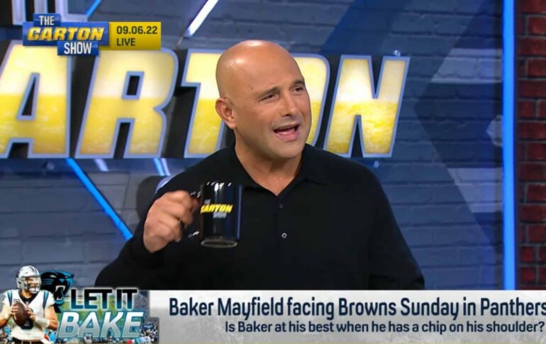 Craig Carton sitting at WFAN radio microphone