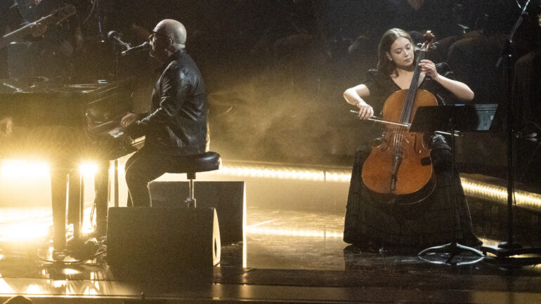 Laufey performing live on stage with cello